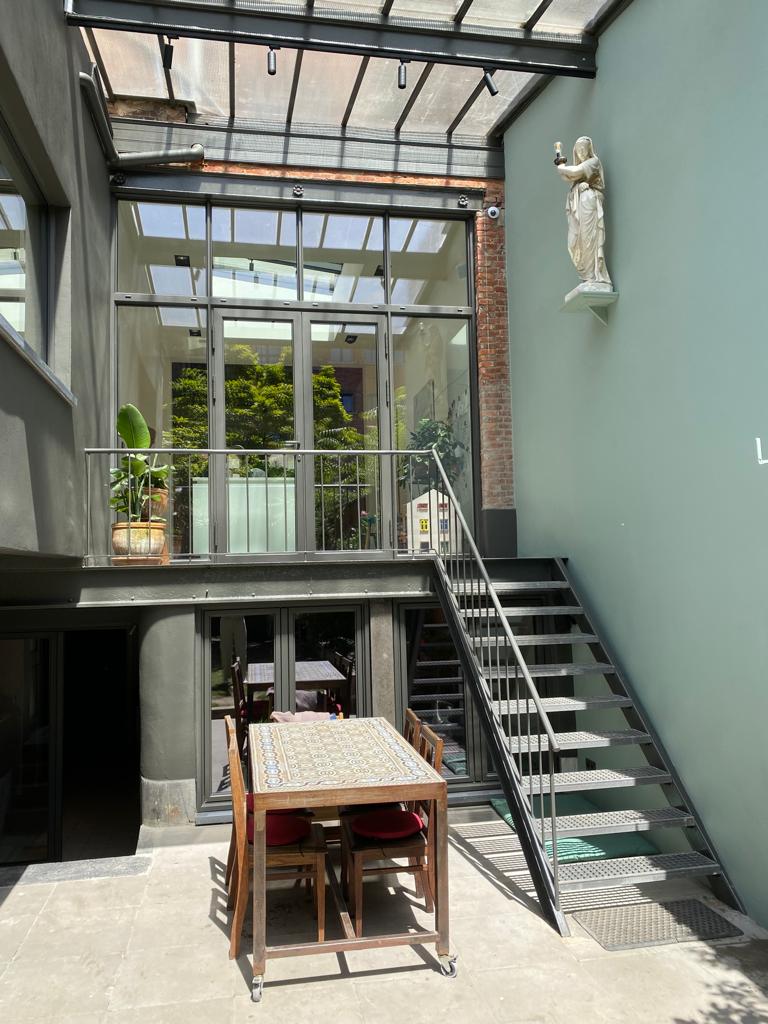 Sheltered outdoor terrace adjacent to the workspace